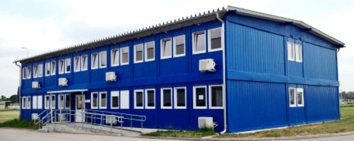 Container based modular office building as project office and construction office during completion of the construction project HKA-EOS. The two-storey modular office building with ridged roof construction was realized in 2016.