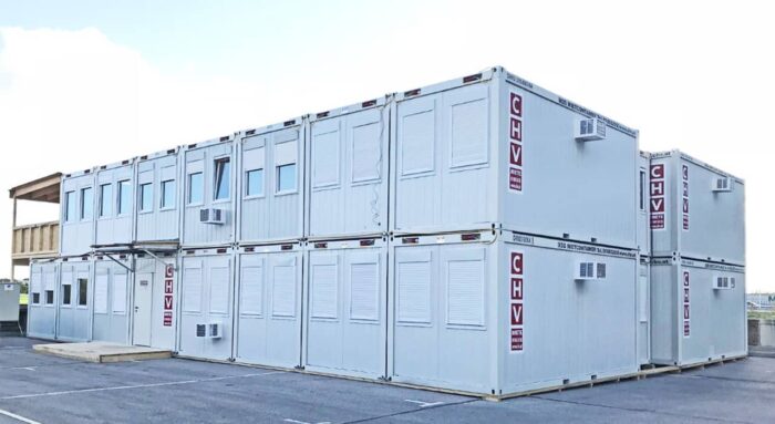 Two-story modular building housing the temporary on-site construction offices for the Austro Control headquarters building project. The modular building is made up of of 29 containers where offices, meeting rooms, sanitary facilities, storage space and a staff-kitchen are housed. Built in 2019.